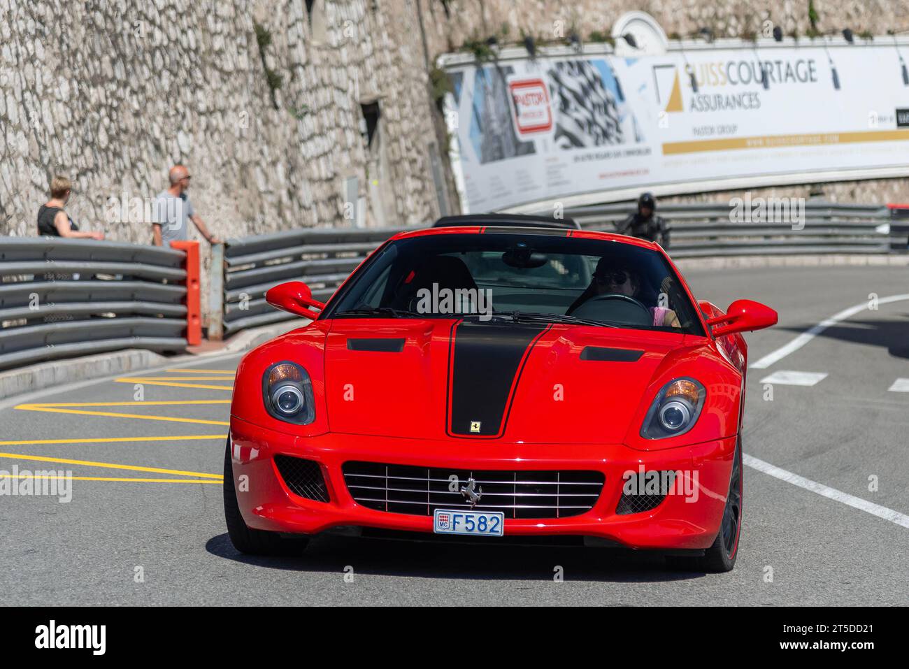Red Ferrari 599 GTB Fiorano driving on the road in the Fairmont Hairpin Stock Photo