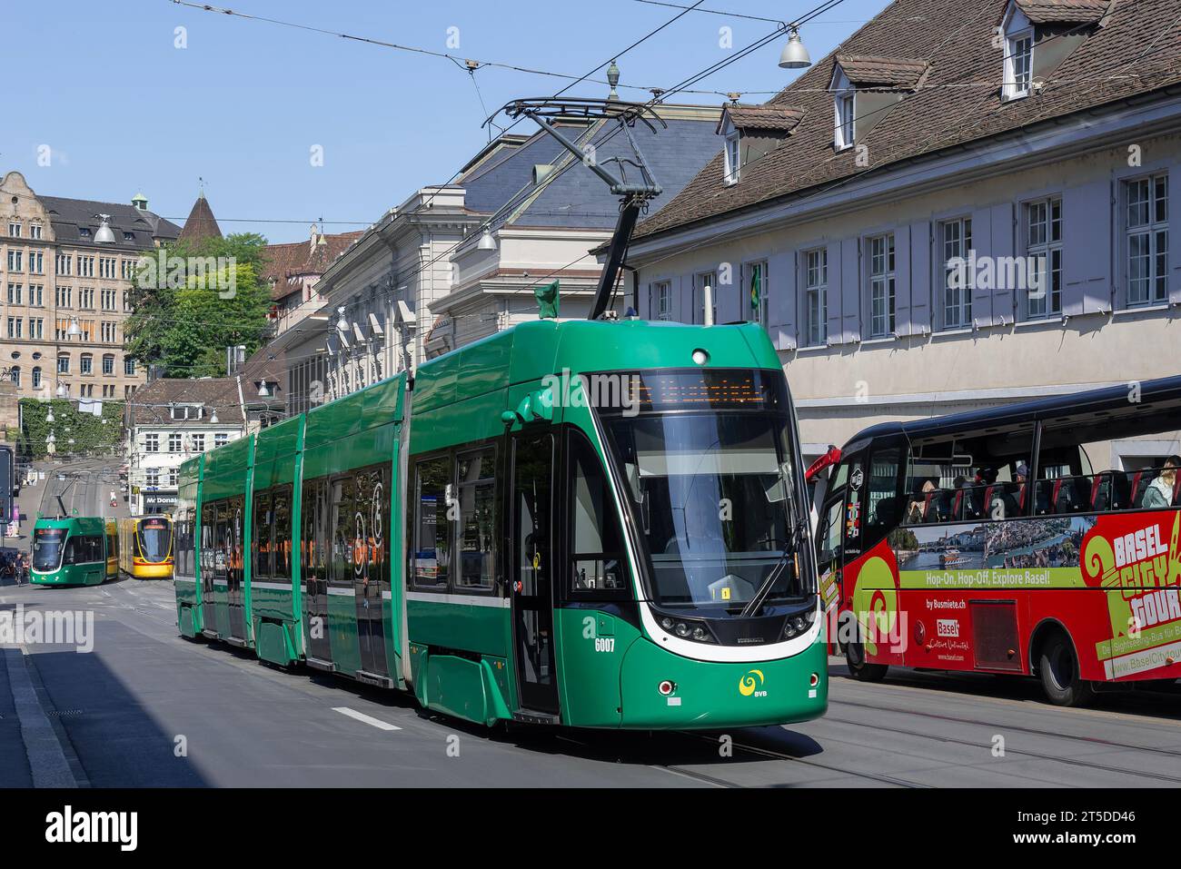 Basel, Switzerland - Green tram Bombardier Flexity 2 in a street. Stock Photo