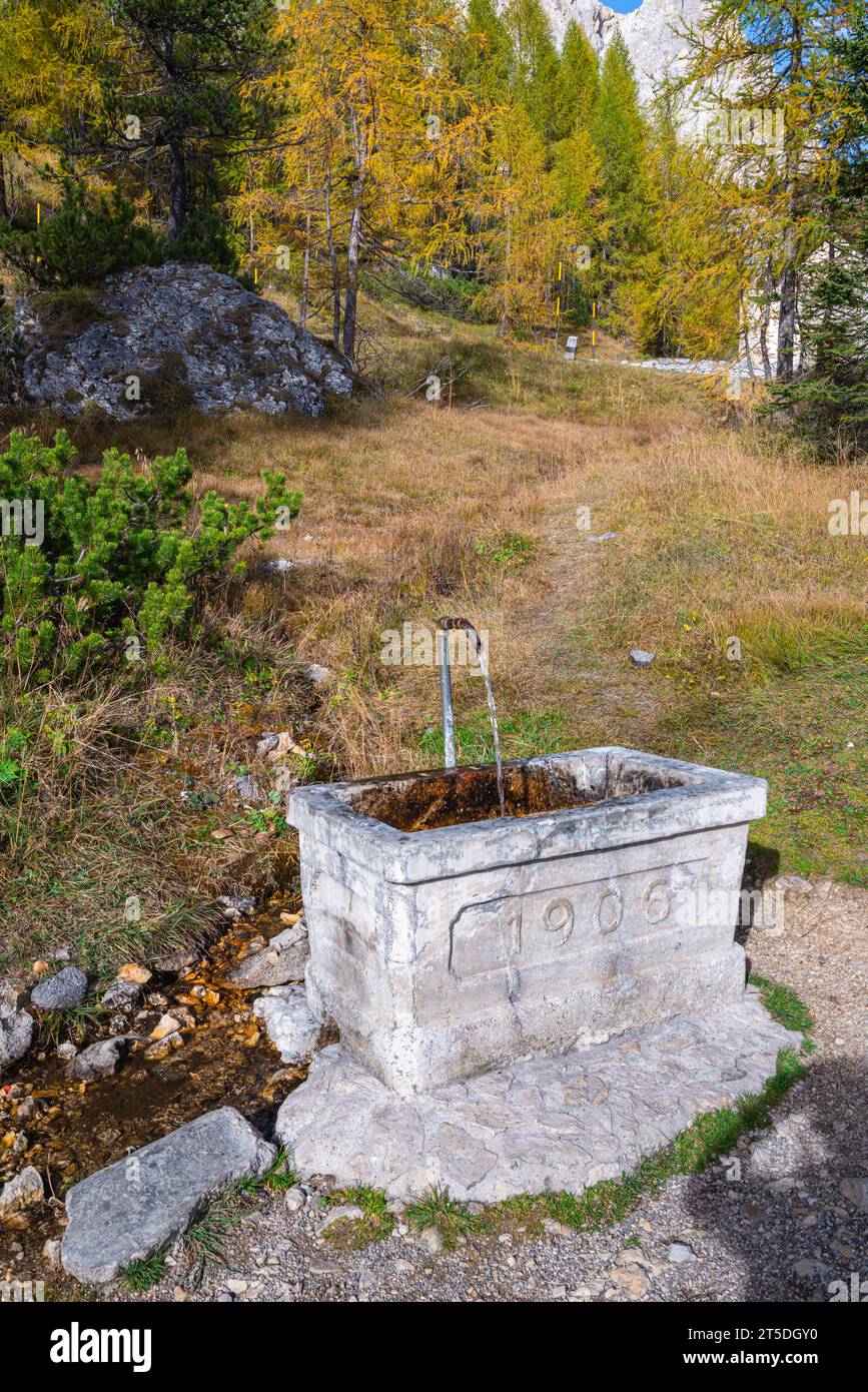 Old stone vessel with mountain water Stock Photo