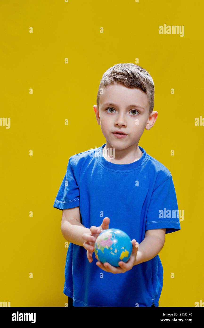 Boy wearing a blue t shirt hi-res stock photography and images - Alamy