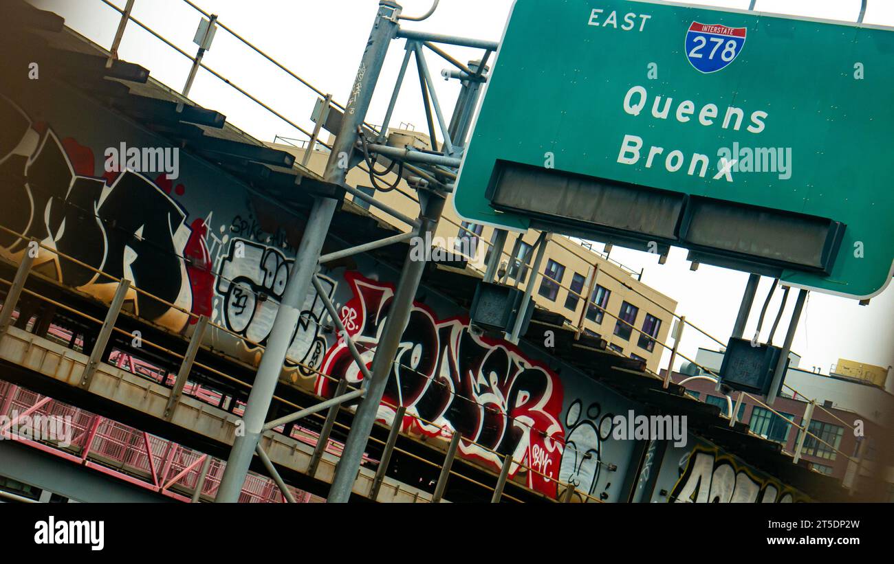 Highway sign, I-278 East, Queens and the Bronx, New York City, graffiti on the Williamsburg Bridge in Brooklyn Stock Photo