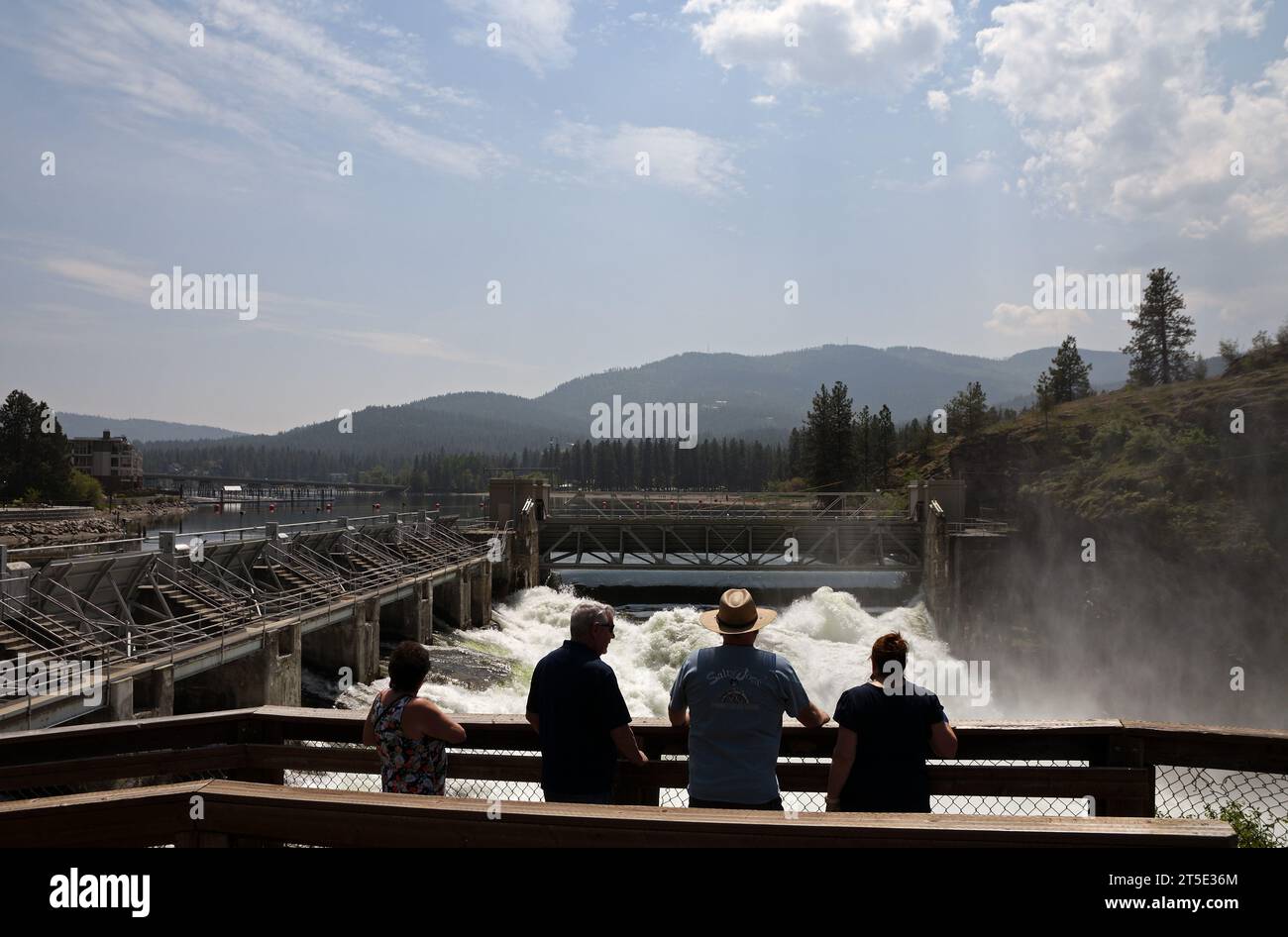 Tourists view Post Falls Dam along the Spokane River in spring. Post Falls, North Idaho. Stock Photo