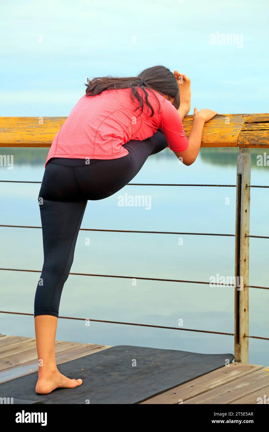 Yoga exercisers are in the park Stock Photo