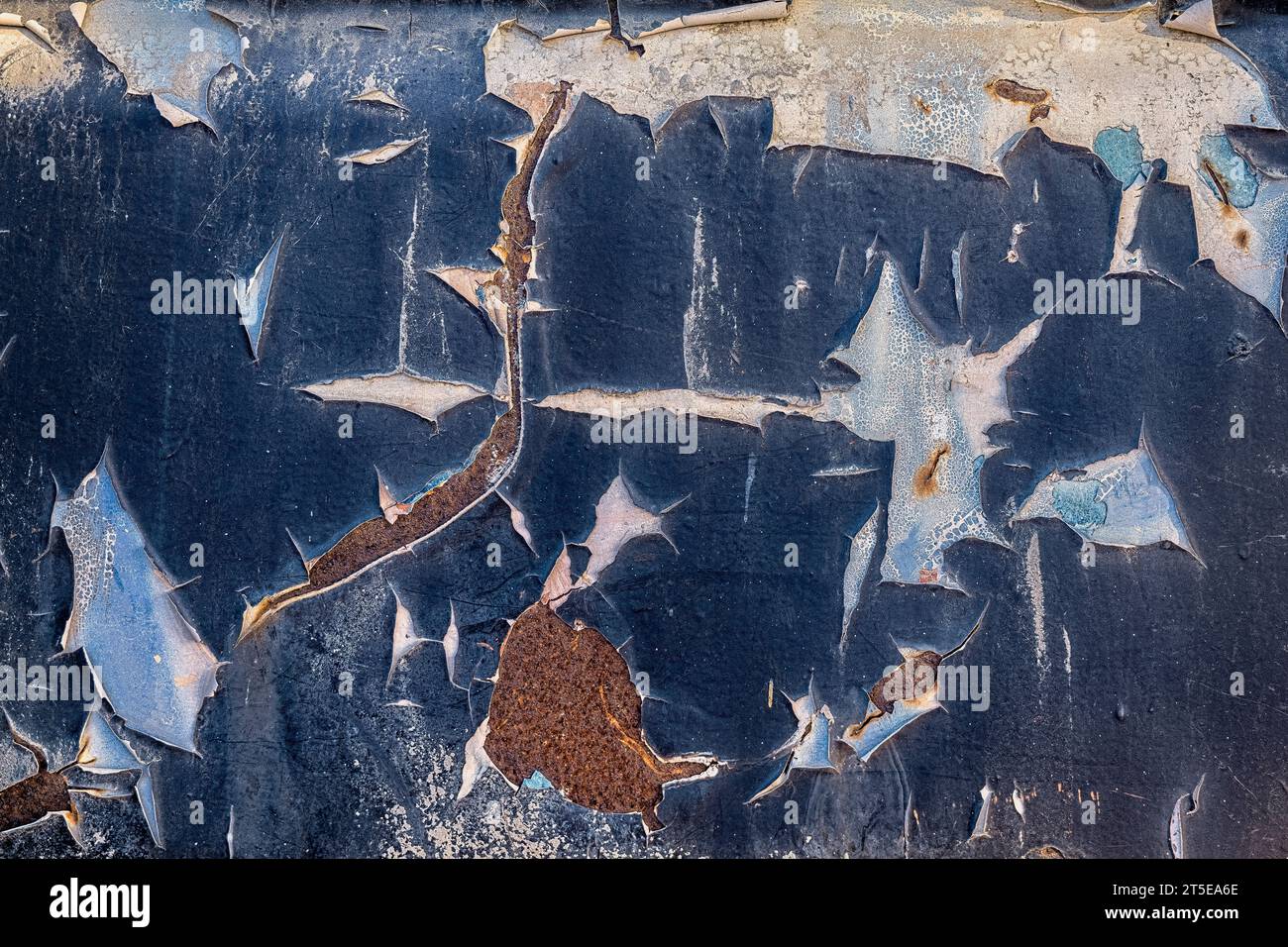Peeling old blue paint with rust. Abstract background pattern Stock Photo