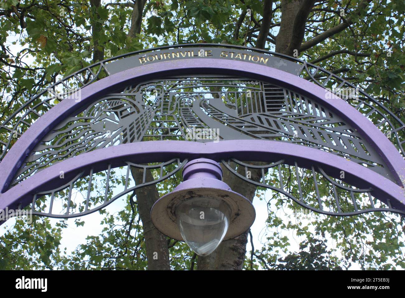 Entrance arch in the colour of Cadburys at Bournville railway station in Birmingham Stock Photo