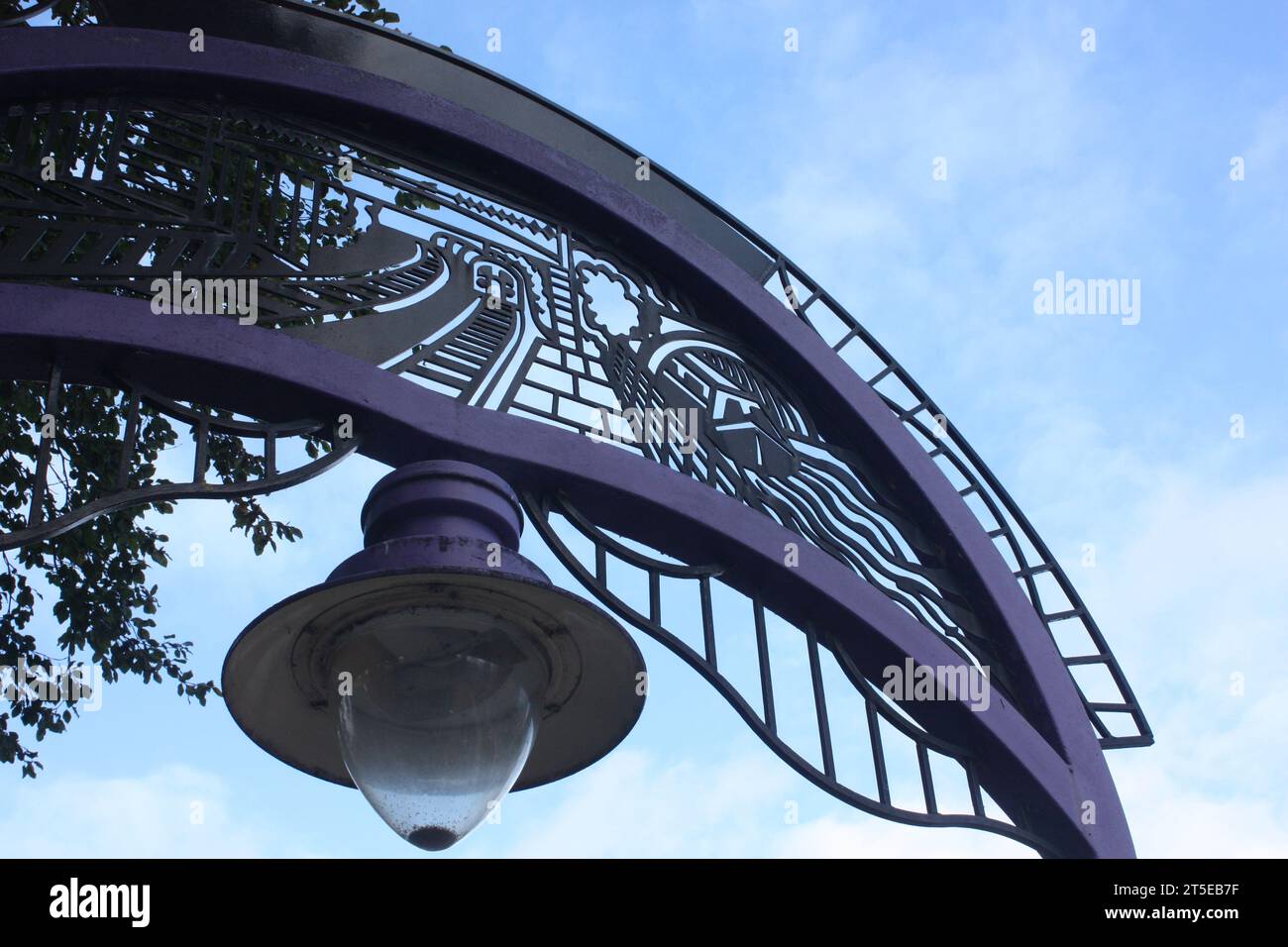 Entrance arch in the colour of Cadburys at Bournville railway station in Birmingham Stock Photo
