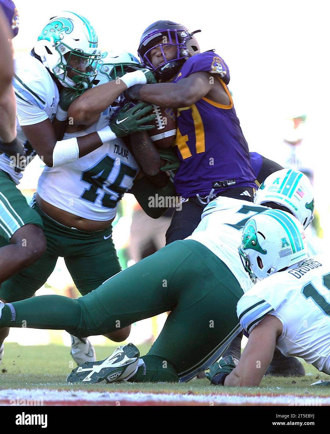 East Carolina's Rahjai Harris (47) fights to retain possession against