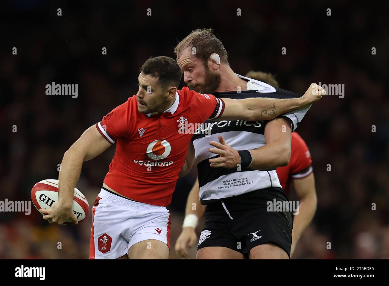 Cardiff, UK. 04th Nov, 2023. Tomos Williams of Wales holds off a tackle from Alun Wyn Jones of Barbarians (r). Wales v Barbarians at the Principality Stadium in Cardiff on Saturday 4th November 2023. pic by Andrew Orchard/Andrew Orchard sports photography/ Alamy Live News Credit: Andrew Orchard sports photography/Alamy Live News Stock Photo