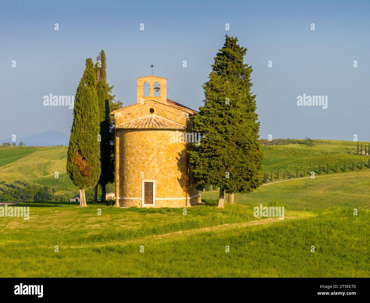 Chapel of the Madonna di Vitaleta, soon after sunrise, Tuscany, Italy. Stock Photo