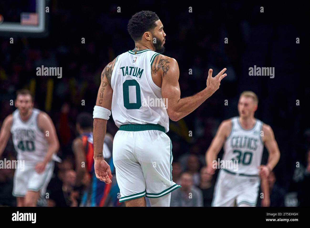 Sign Jayson Boston Celtics' Jayson Tatum, center, celebrates a 3-pointer against ...