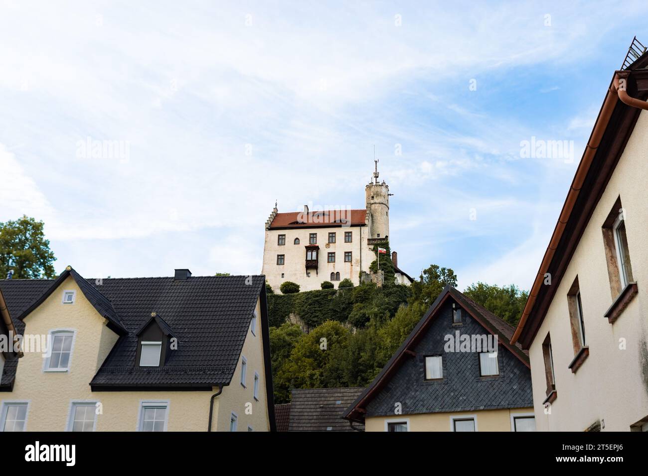 Hilltop castle in Gößweinstein in the Franconian Switzerland. The medieval building is located above the town. The landmark is a popular destination. Stock Photo