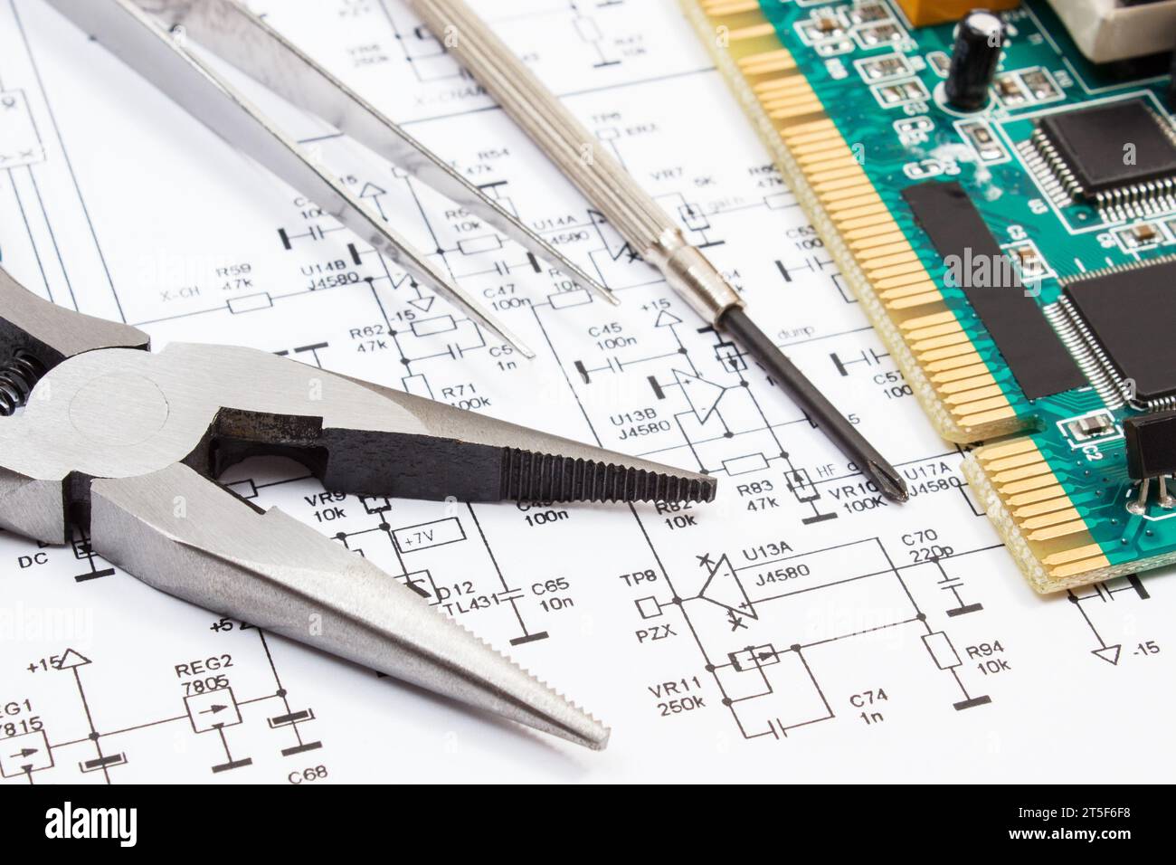 Printed circuit board with transistors, resistors, capacitor. Diagram of electronics and
