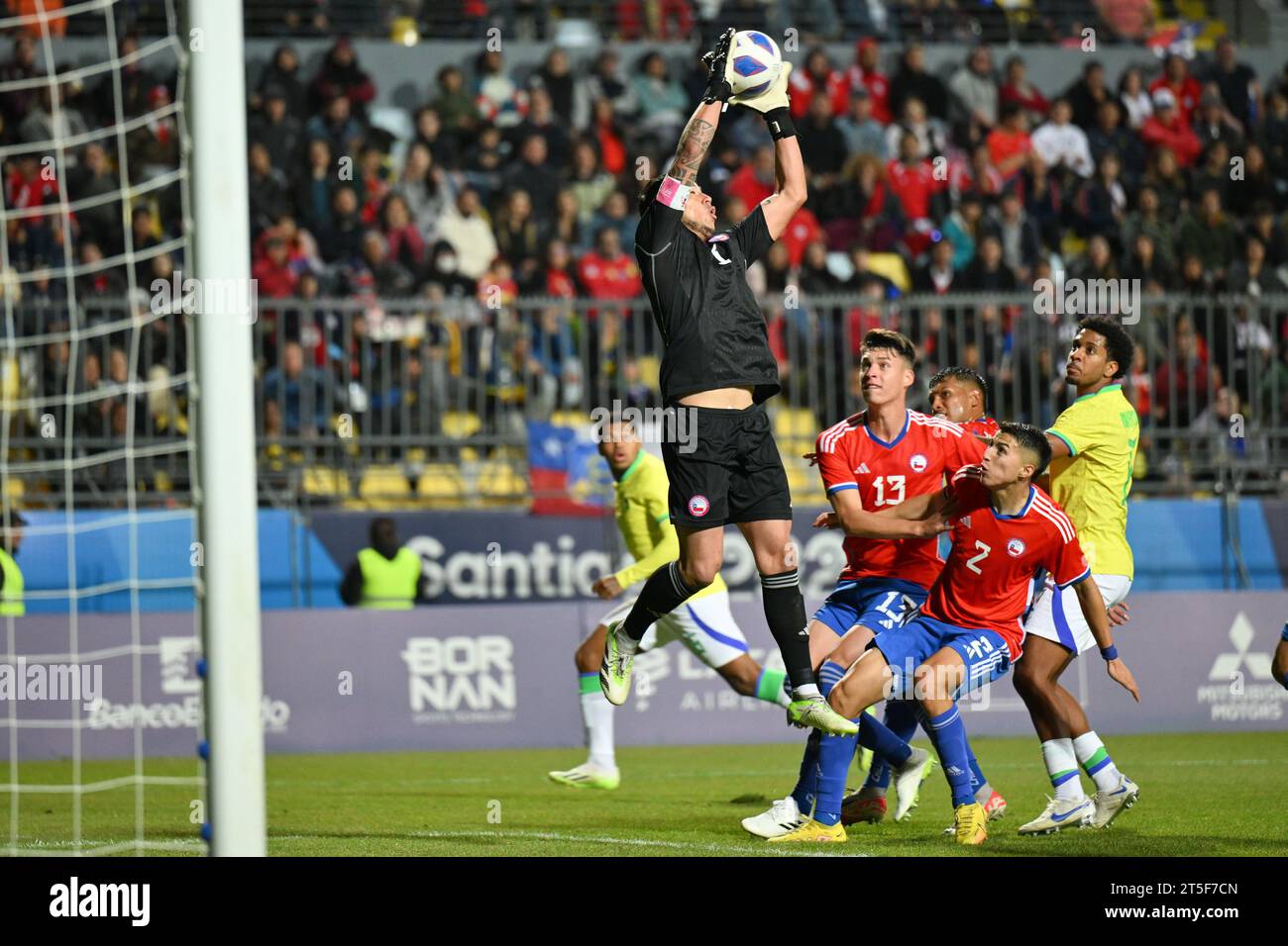 Vina Del Mar, Chile. 4th Nov, 2023. Brayan Cortes (top), goalkeeper of Chile, saves the ball during the men's gold medal match of the football event between Brazil and Chile at Pan American Games 2023, in Vina Del Mar, Chile, on Nov. 4, 2023. Credit: Xin Yuewei/Xinhua/Alamy Live News Stock Photo