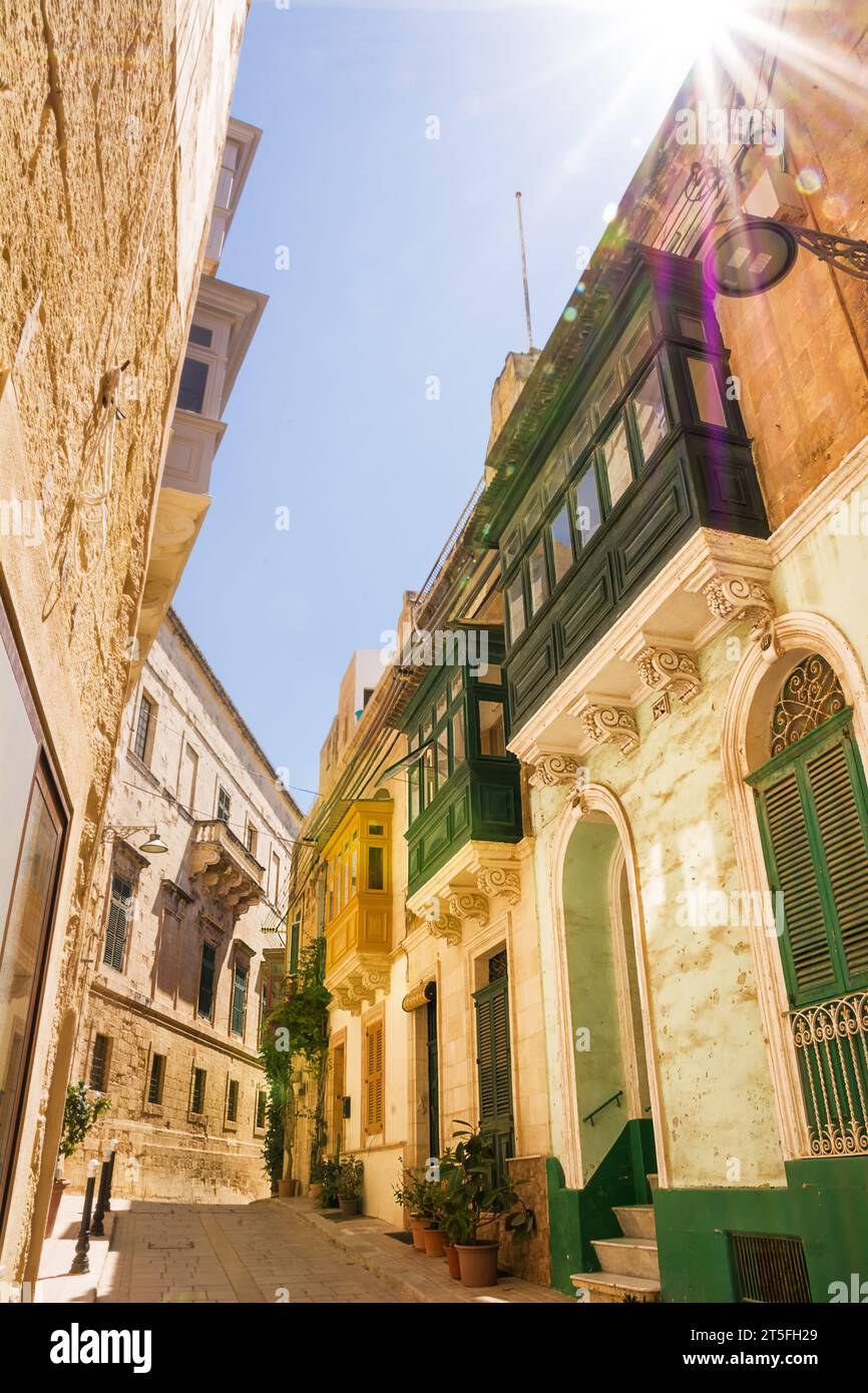 Closed and typical Maltese balconies called gallarija and sunbeams Stock Photo