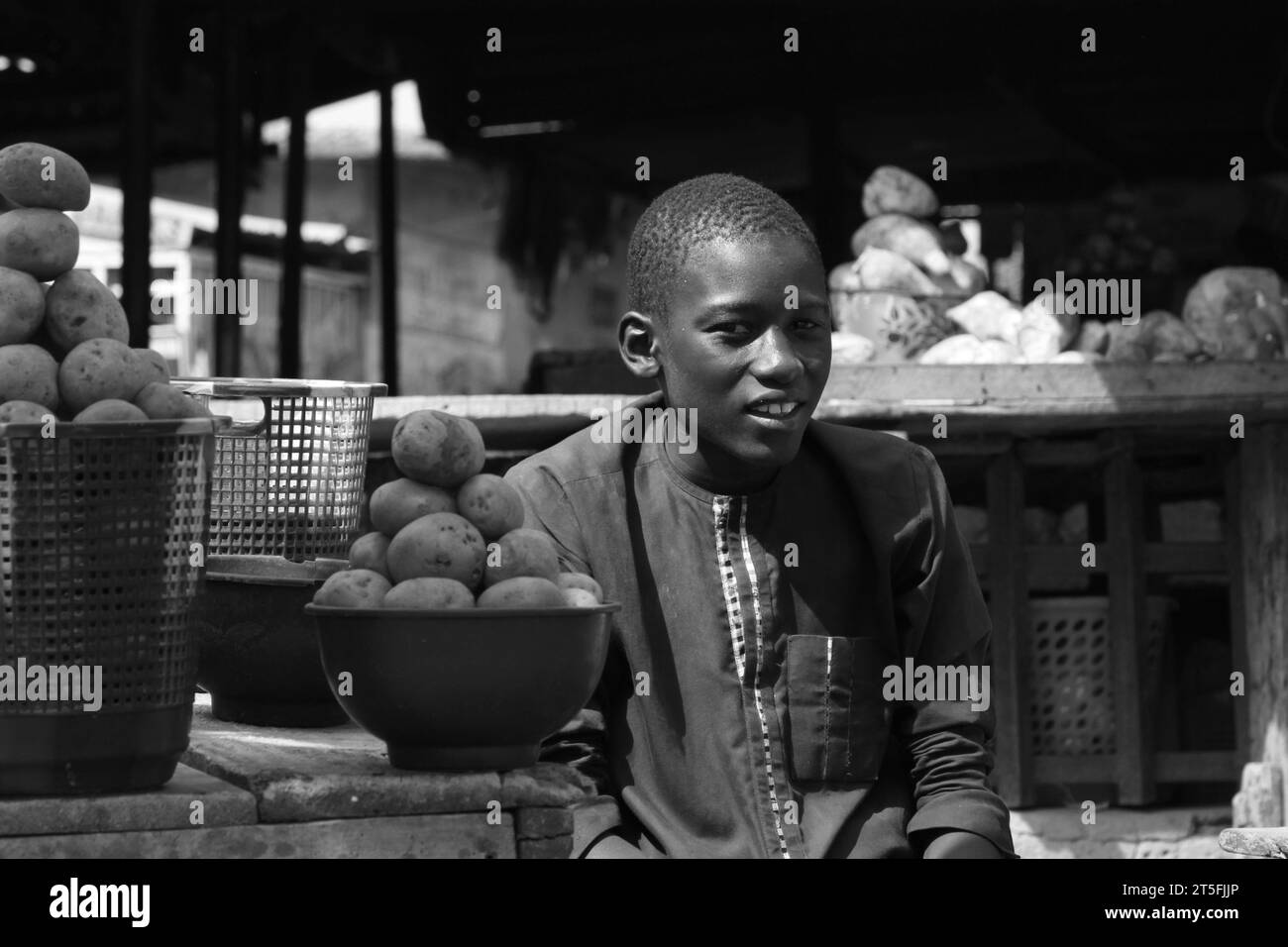 a day at market in Kano state Nigeria, showing how people are passing by, unable to buy enough food due to the rise in prices. Stock Photo