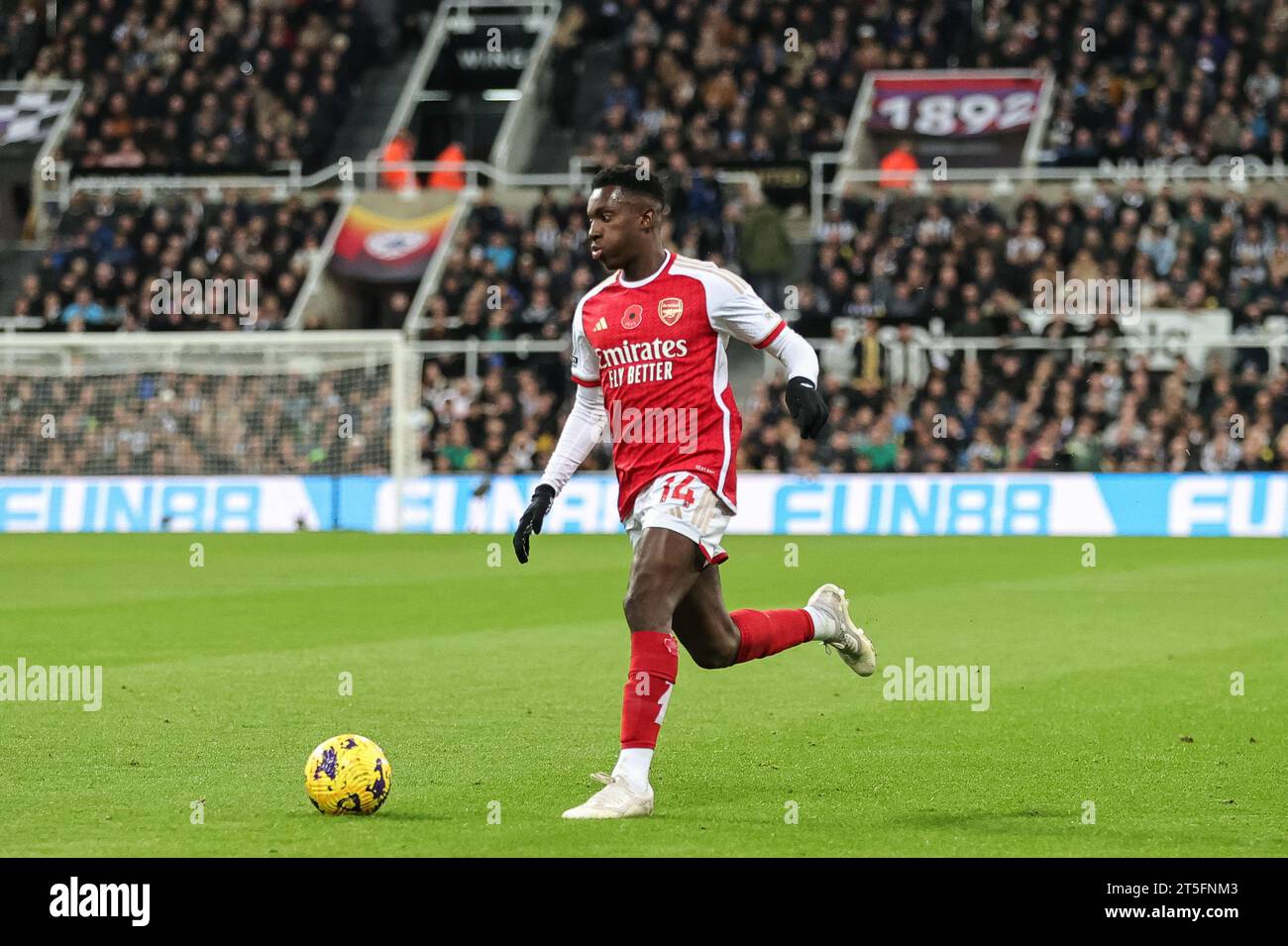 Eddie Nketiah #14 of Arsenal breaks with the ball during the Premier League match Newcastle United vs Arsenal at St. James's Park, Newcastle, United Kingdom, 4th November 2023 (Photo by Mark Cosgrove/News Images) Stock Photo