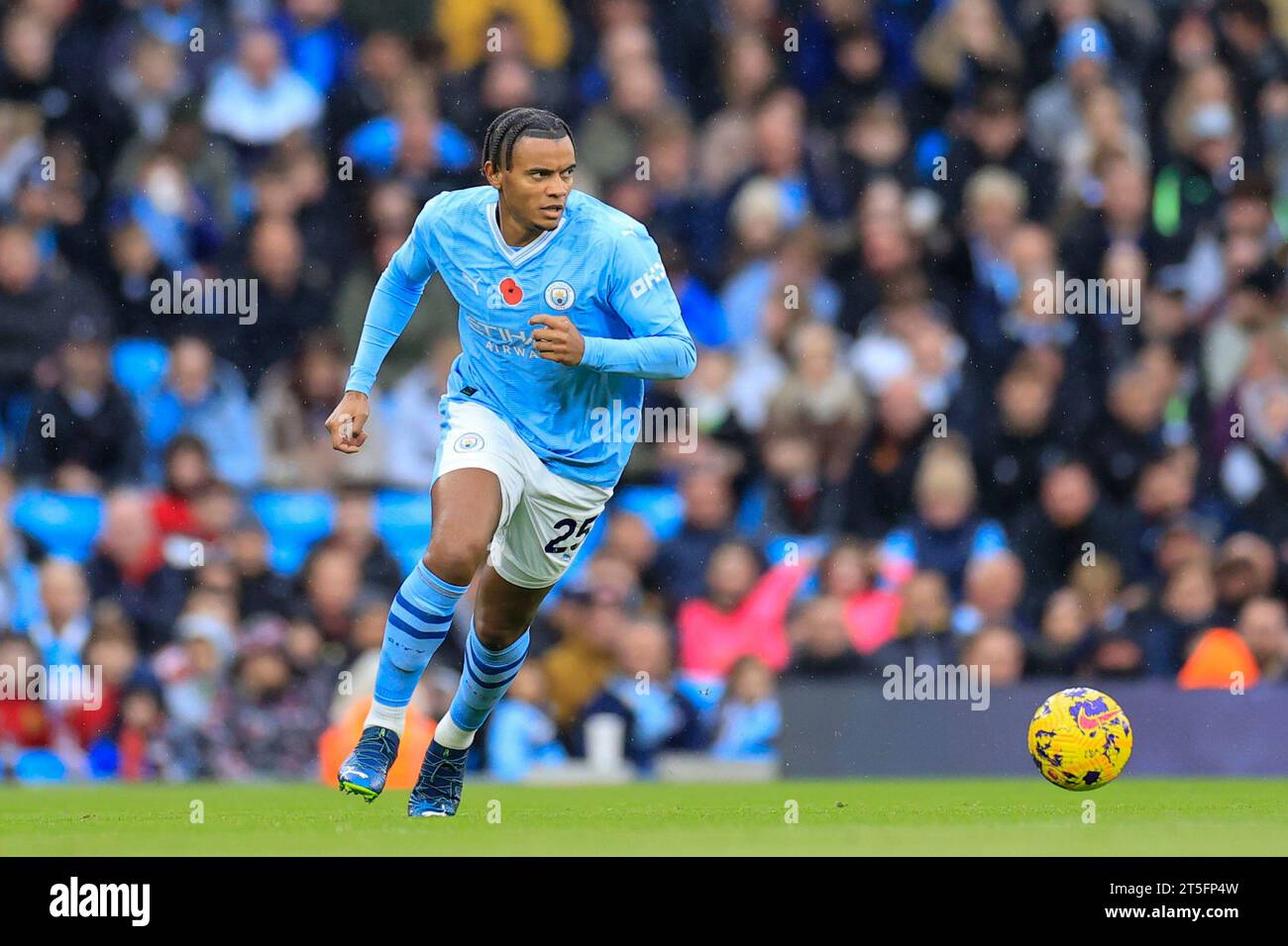 Manchester City's Manuel Akanji heads the ball during the