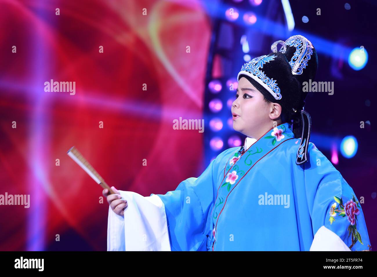 LUANNAN COUNTY - JANUARY 4: The boy singing PingJu on the stage, in the ChengZhaoCai grand theater, January 4, 2014,luannan county, hebei province, ch Stock Photo