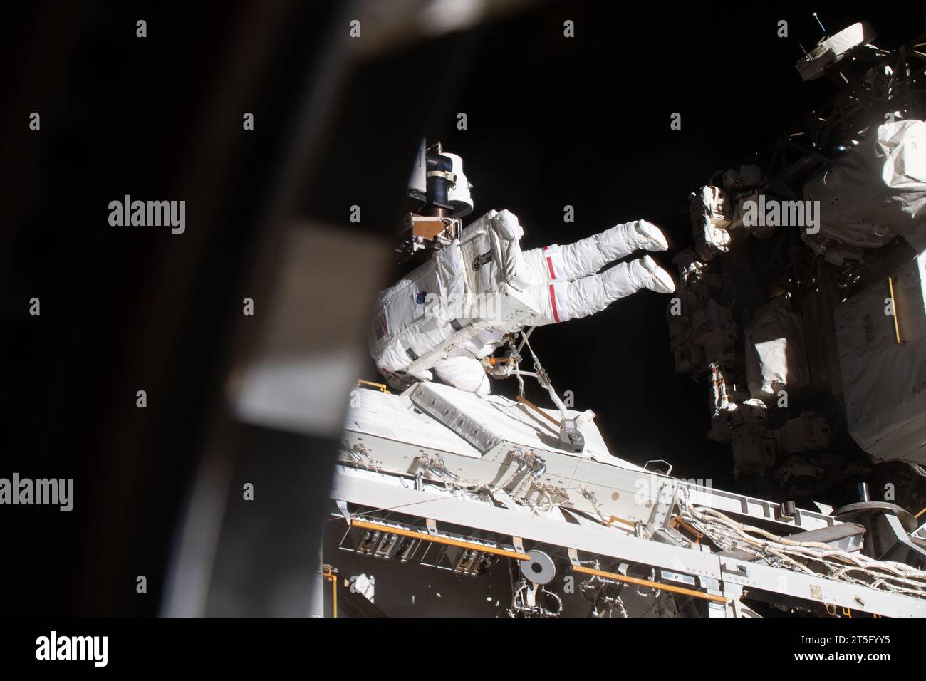 International Space Station, Earth Orbit. 01 November, 2023. NASA astronaut and Expedition 70 Flight Engineer Jasmin Moghbeli performs a spacewalk to replace one of the 12 trundle bearing assemblies on the port solar alpha rotary joint, outside the International Space Station, November 1, 2023 in Earth Orbit. The assembly allows the solar arrays to track the Sun and generate electricity to power the orbiting laboratory. Credit: NASA Astronaut/NASA/Alamy Live News Stock Photo