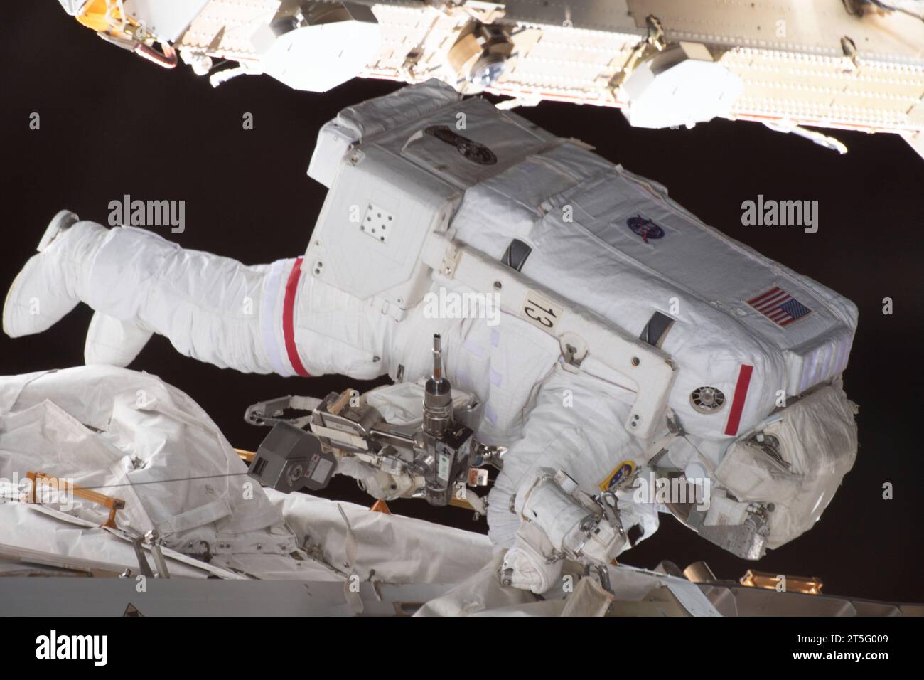 International Space Station, Earth Orbit. 01 November, 2023. NASA astronaut and Expedition 70 Flight Engineer Jasmin Moghbeli performs a spacewalk to replace one of the 12 trundle bearing assemblies on the port solar alpha rotary joint, outside the International Space Station, November 1, 2023 in Earth Orbit. The assembly allows the solar arrays to track the Sun and generate electricity to power the orbiting laboratory. Credit: NASA Astronaut/NASA/Alamy Live News Stock Photo