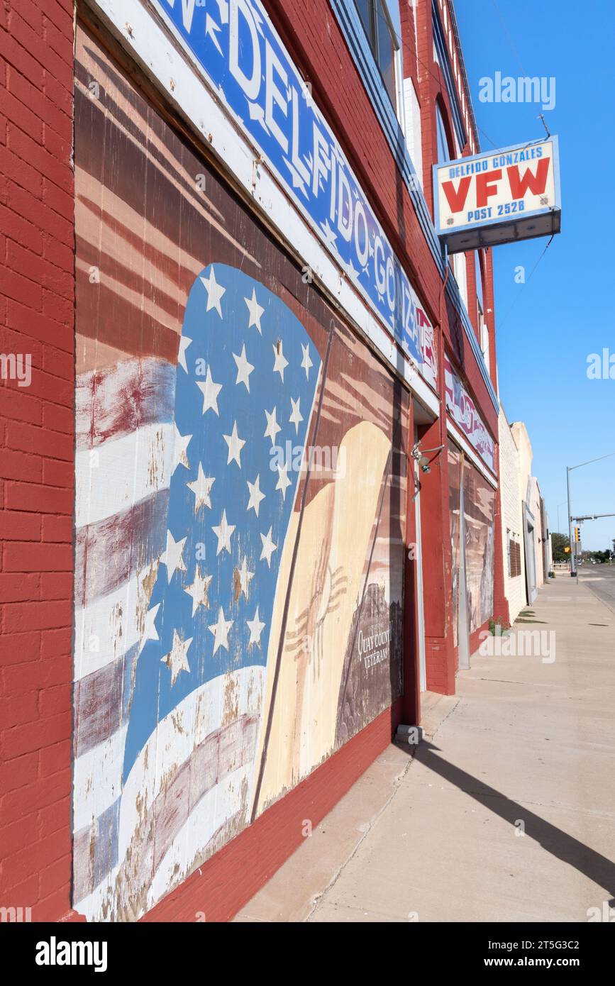 Brightly painted red, white and blue facade of VFW, Post 2528, with painted American flag, Tucumcari, Quay County, New Mexico, United States. Stock Photo
