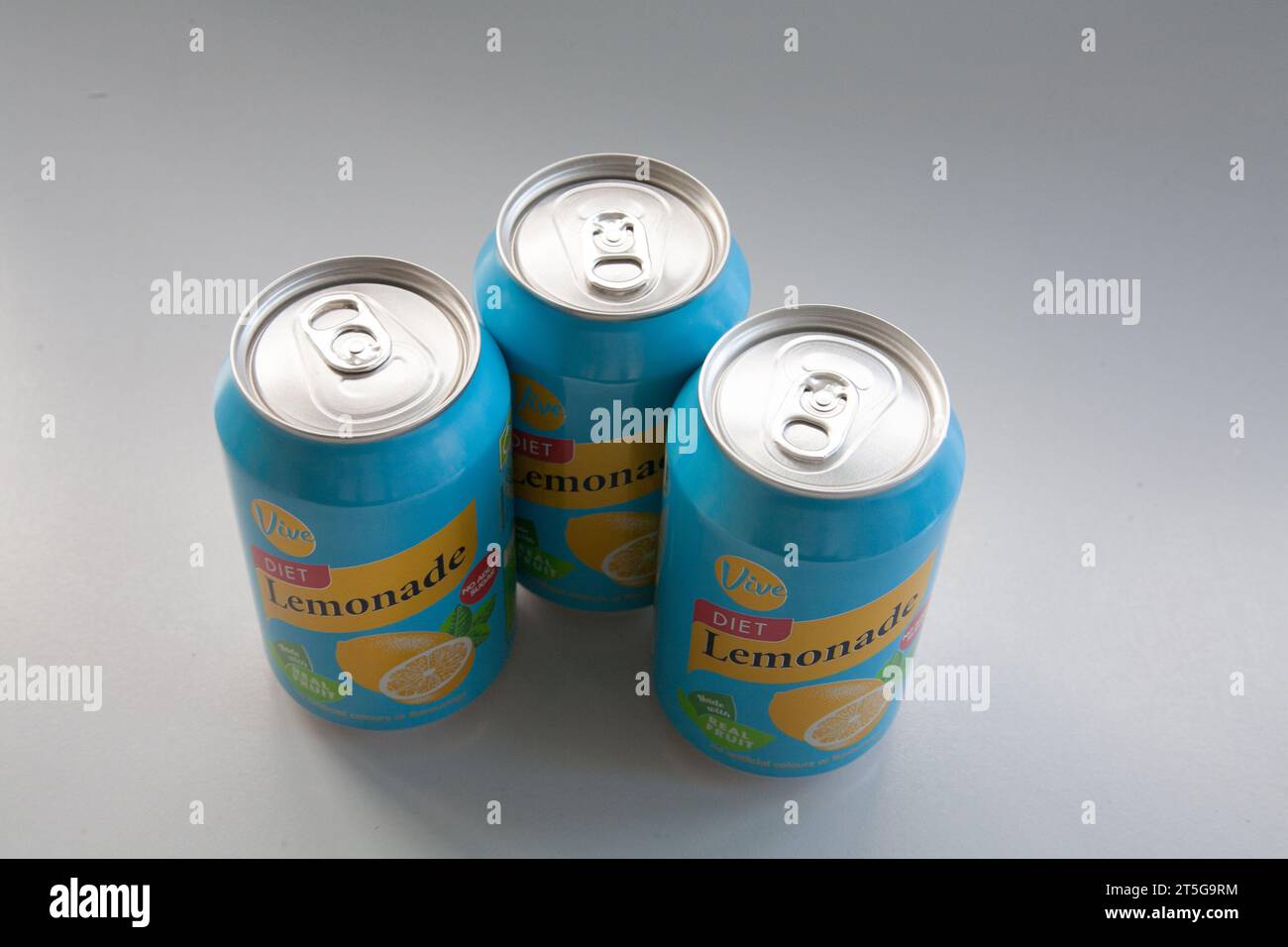 Three cans of diet lemonade with no added sugar on white background low