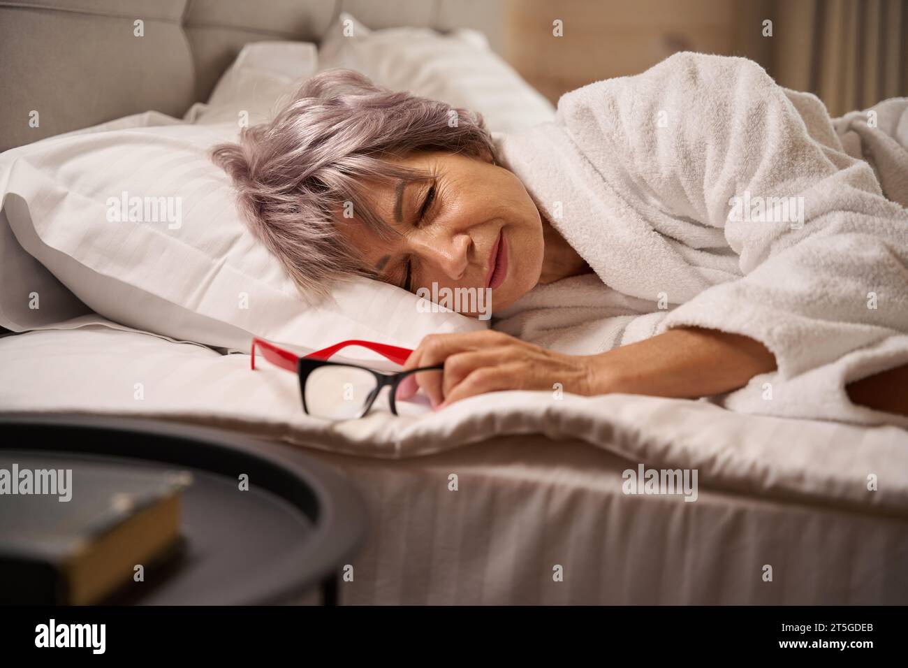 Dozing Activity An old woman dozing hi-res stock photography and images - Alamy