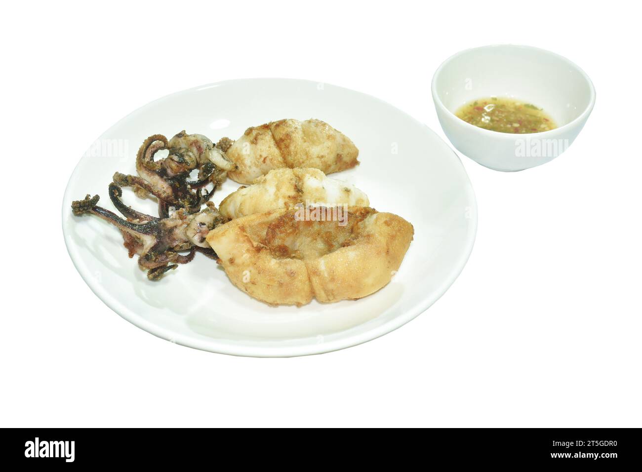 crispy fried squid with garlic dipping spicy chili sauce on plate Stock