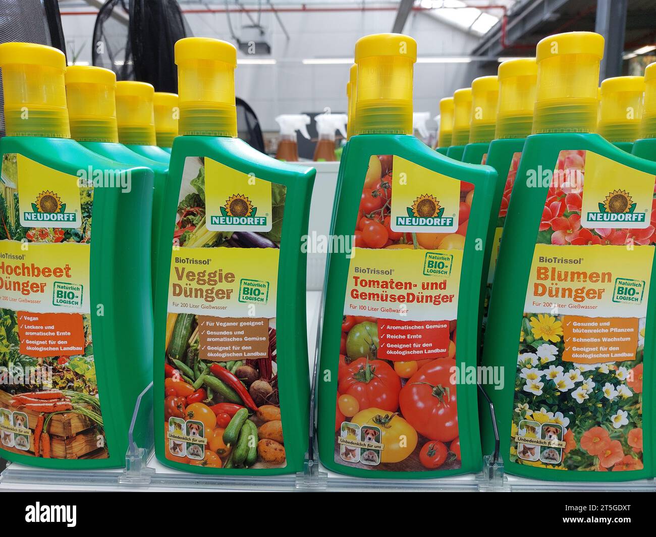 tomato and veggie fertilizer bottles by Neudorff in a garden market Stock Photo
