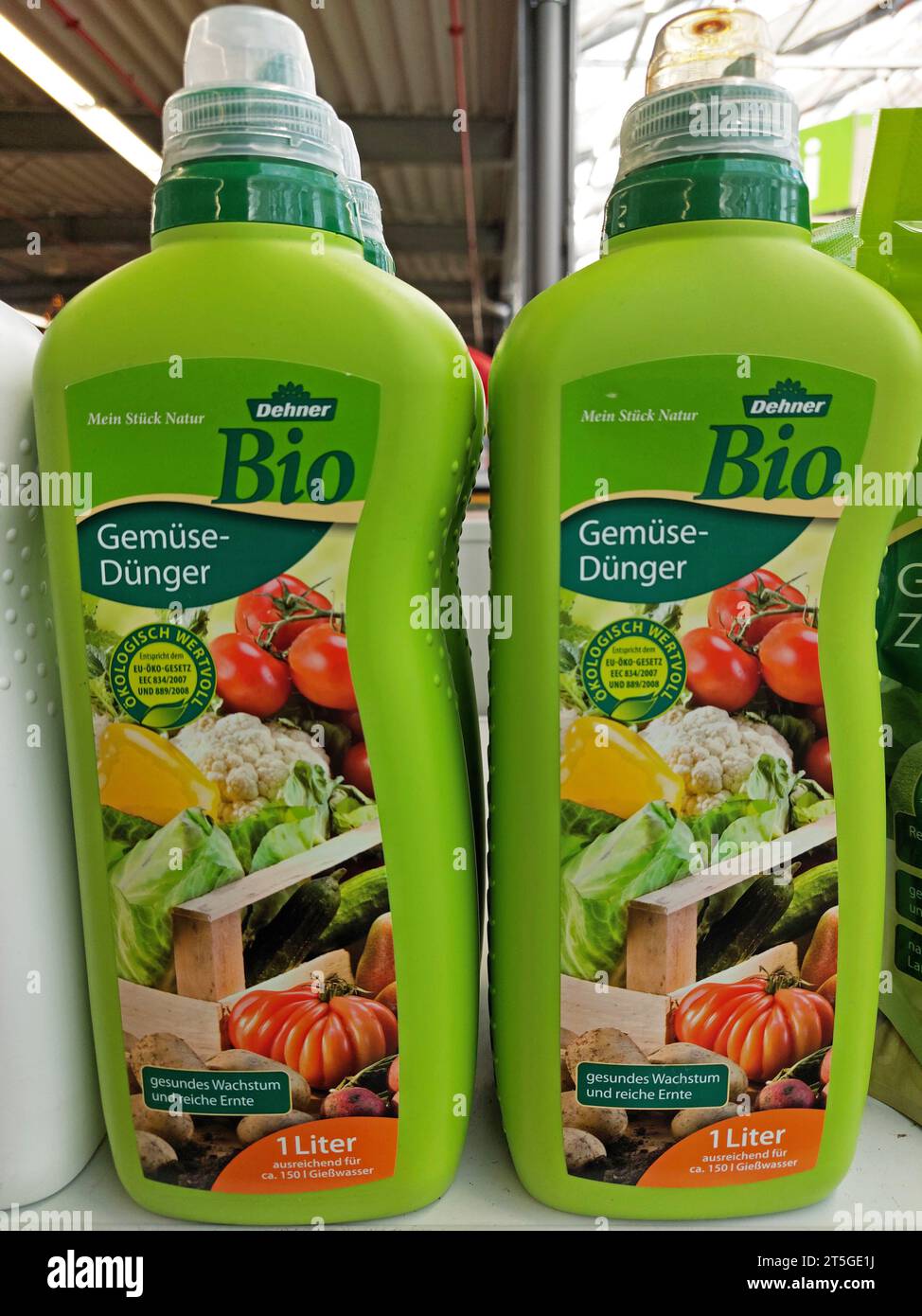 veggie fertilizer bottles by Dehner in a garden market Stock Photo