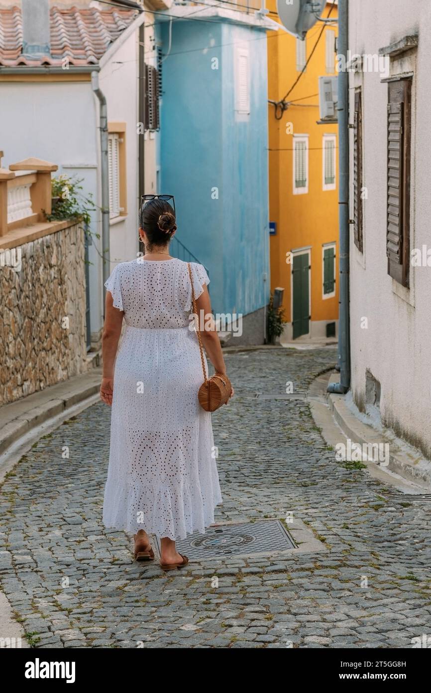 Girl walking dress rear view hi-res stock photography and images - Alamy