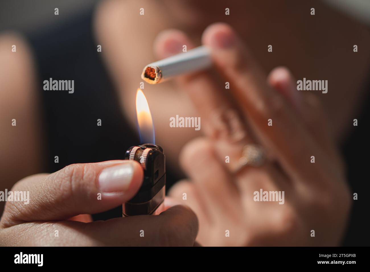 Smoker lighting a cigarette with lighter Stock Photo Alamy