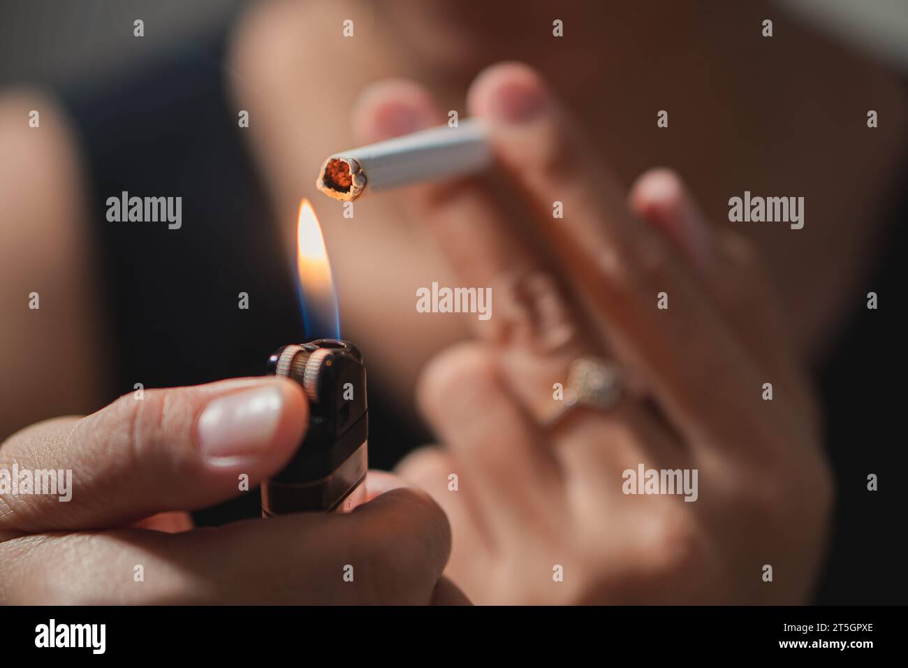 Smoker lighting a cigarette with lighter Stock Photo Alamy