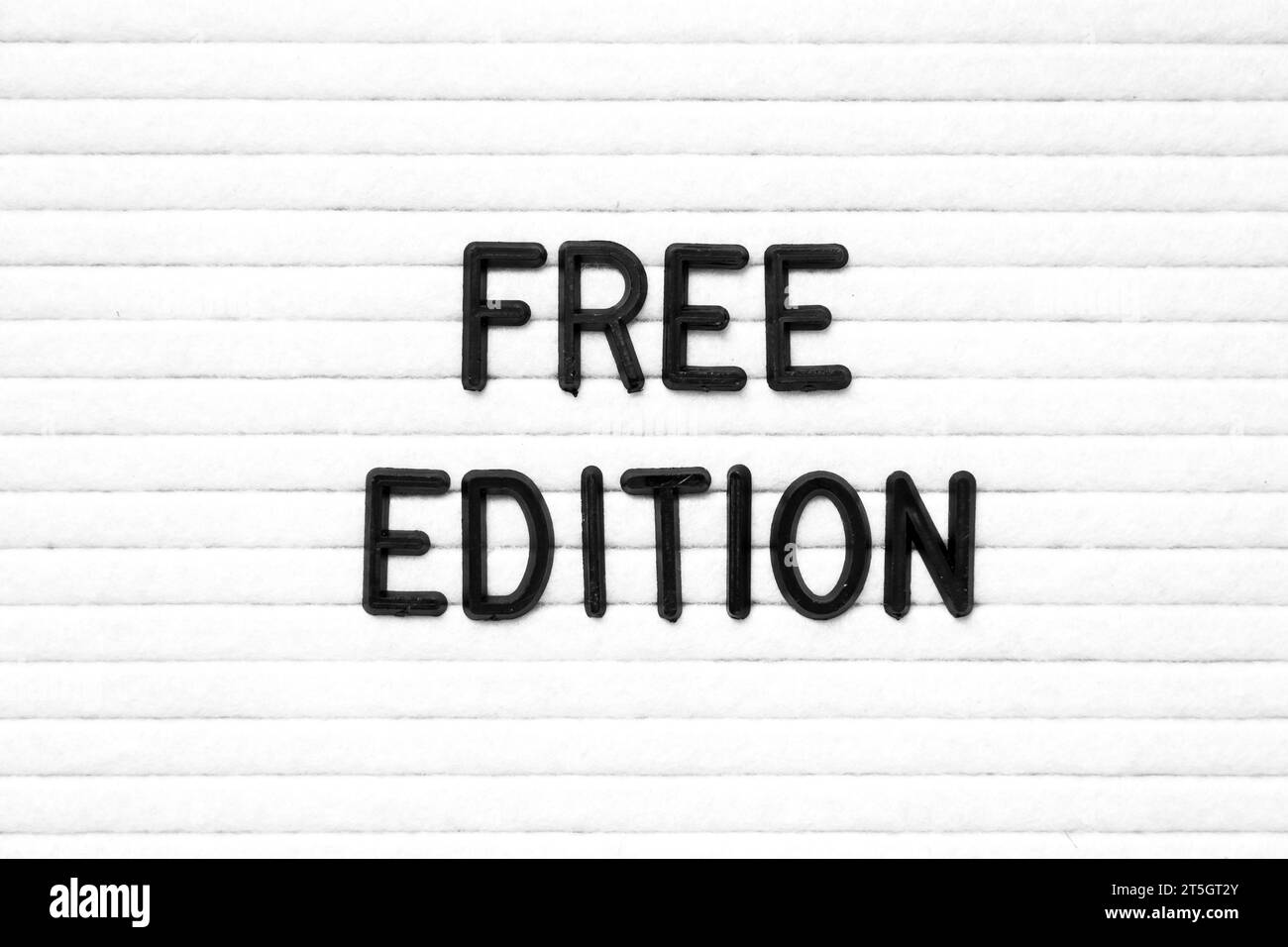 Black color letter in word free edition on white felt board background ...