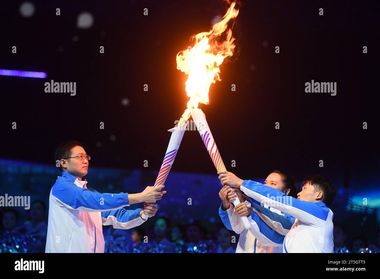 Nanning. 5th Nov, 2023. Torch bearers Nie Shuangxi (L), Huang Yaqing (C ...