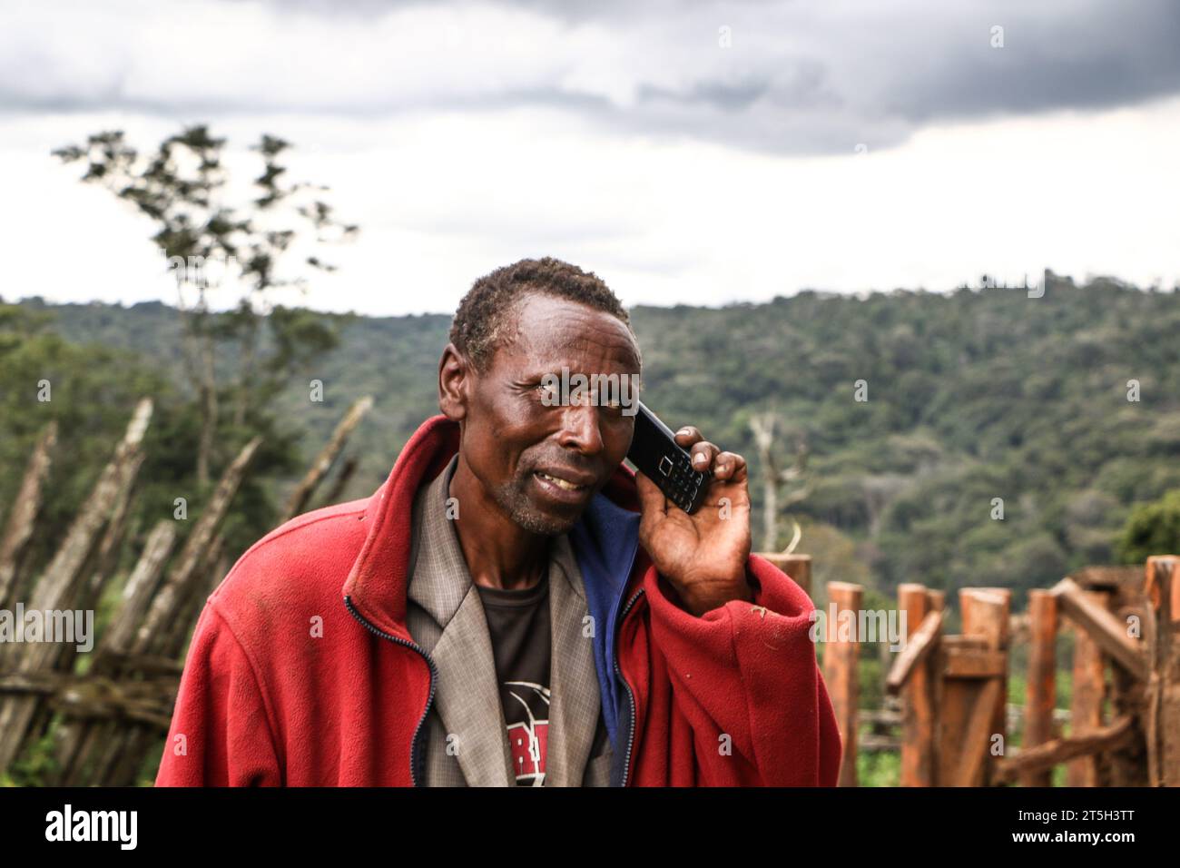Narok, Kenya. 3rd Nov, 2023. Kenyatta Ngusilo, a member of The Ogiek Community makes a phone call near his demolished house in Sasimwani Mau Forest. Hundreds of people from the Ogiek Community have been left homeless and in biting cold after the Government of Kenya embarked on an eviction exercise to remove alleged encroachers of Mau Forest. A statement by Ogiek People's Development Program (OPDP) said that the eviction of forest communities violates their human rights and called on the government to immediately halt the exercise. (Credit Image: © James Wakibia/SOPA Images via ZUMA Press Stock Photo