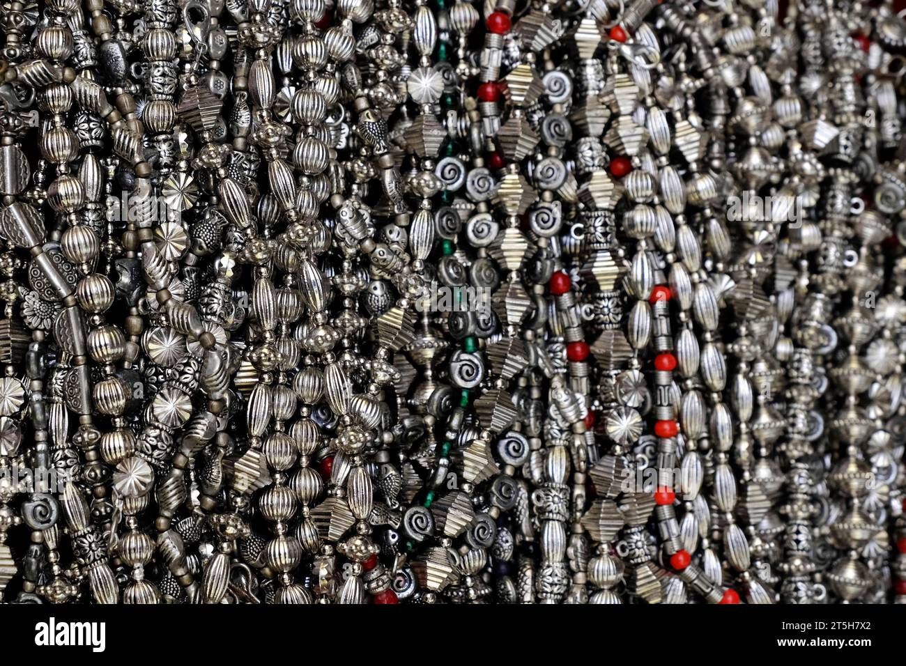 colorful traditional indian jewelry displayed in a street shop for sale