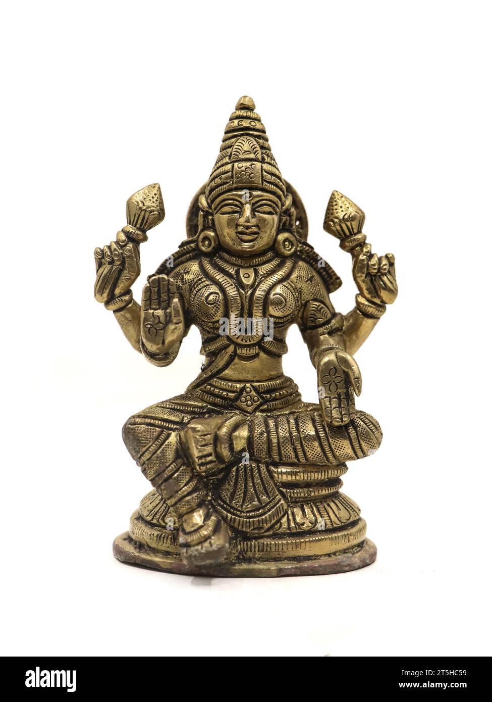 hindu goddess mahalakshmi antique idol with four hands isolated in a