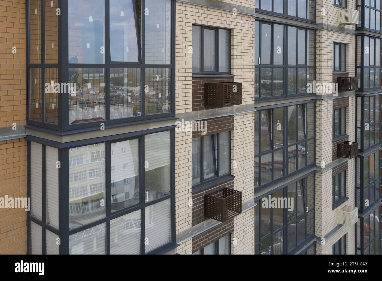 Building with decorative air conditioner covers Stock Photo