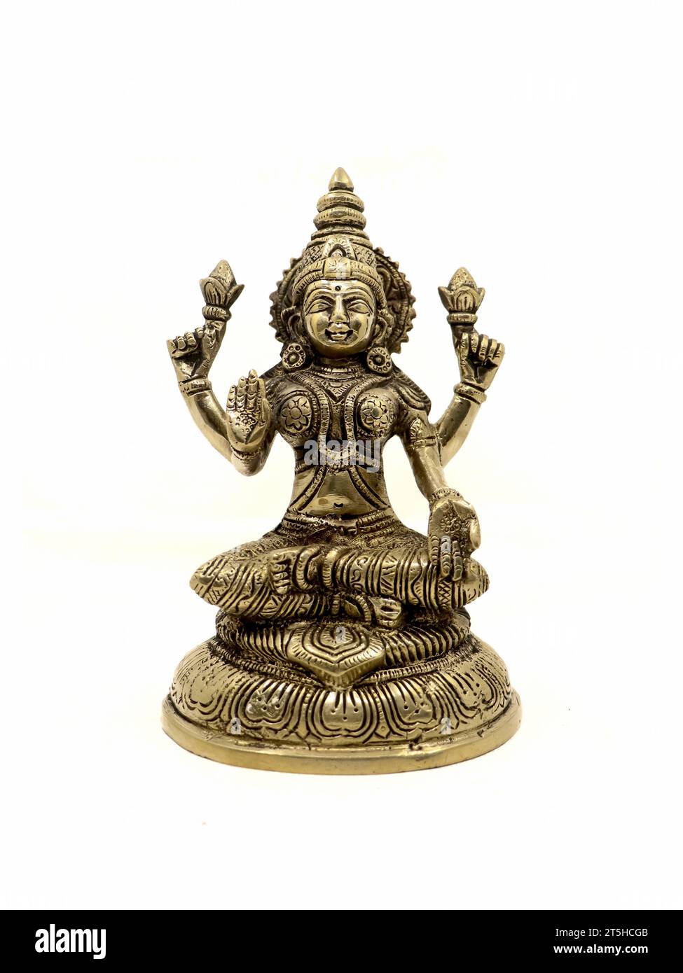 hindu goddess mahalakshmi antique idol with four hands isolated in a