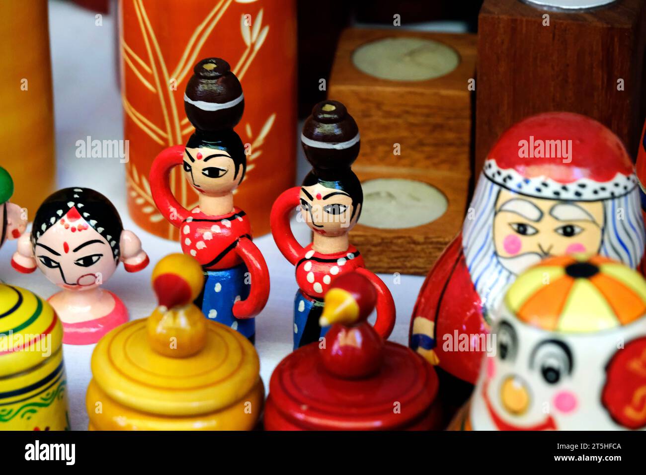 Pune, India, Handicraft items with selective focus, textile and colourful wooden goods with traditional design for sale at Indian Market. Stock Photo