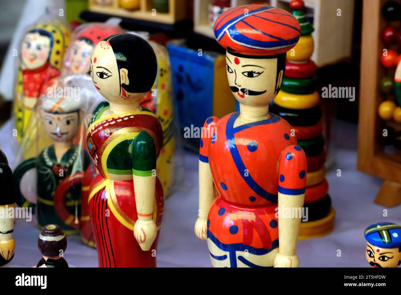 Pune, India, Handicraft items with selective focus, textile and colourful wooden goods with traditional design for sale at Indian Market. Stock Photo