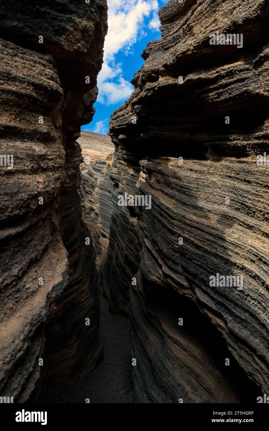 Spain, Lanzarote, Canary Islands: Las Grietas of Montana Blanca, the cracks of White Mountain Stock Photo