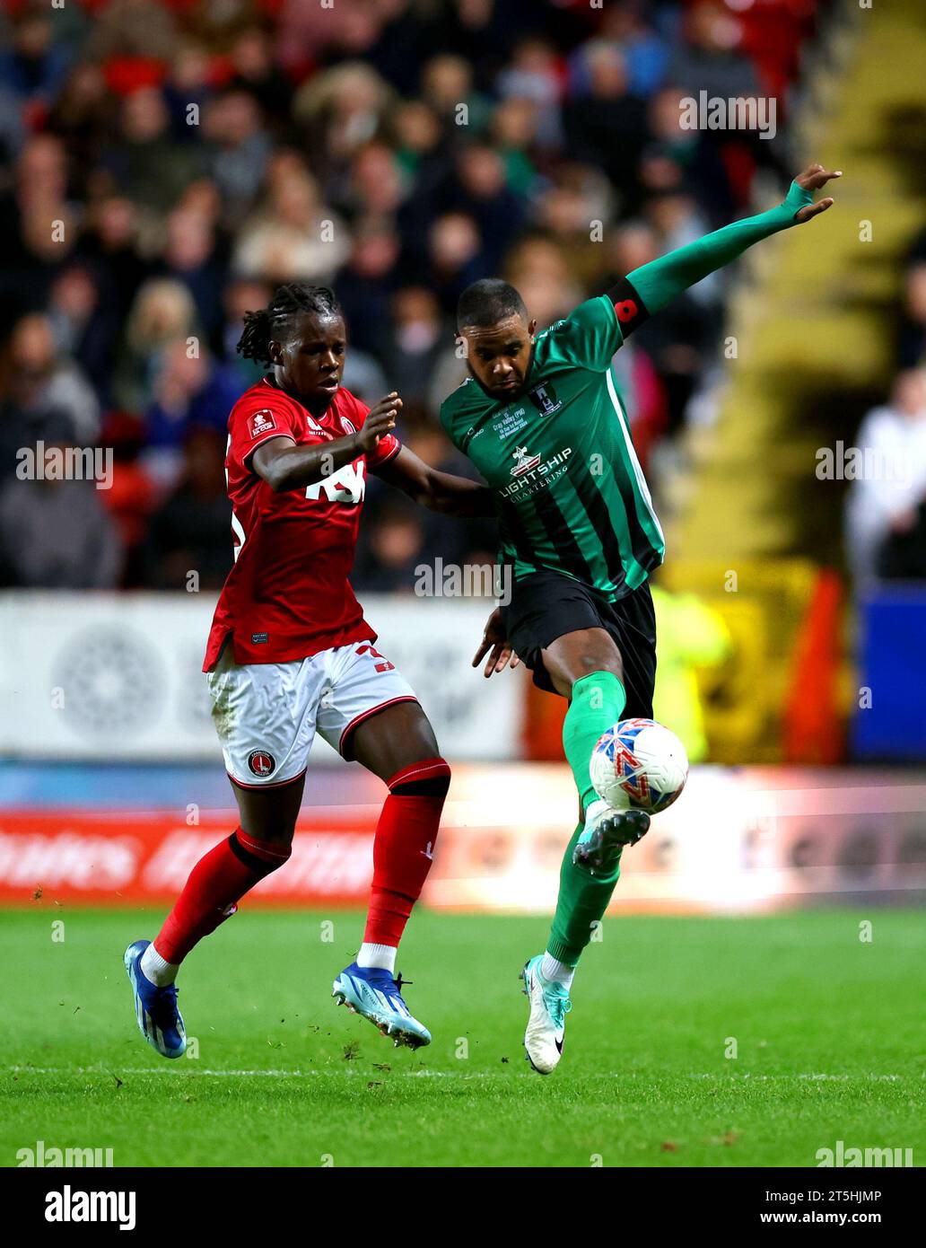 Charlton Athletic's Karoy Anderson (left) and Cray Valley's Sonny Black battle for the ball during the Emirates FA Cup first round match at The Valley, London. Picture date: Sunday November 5, 2023. Stock Photo