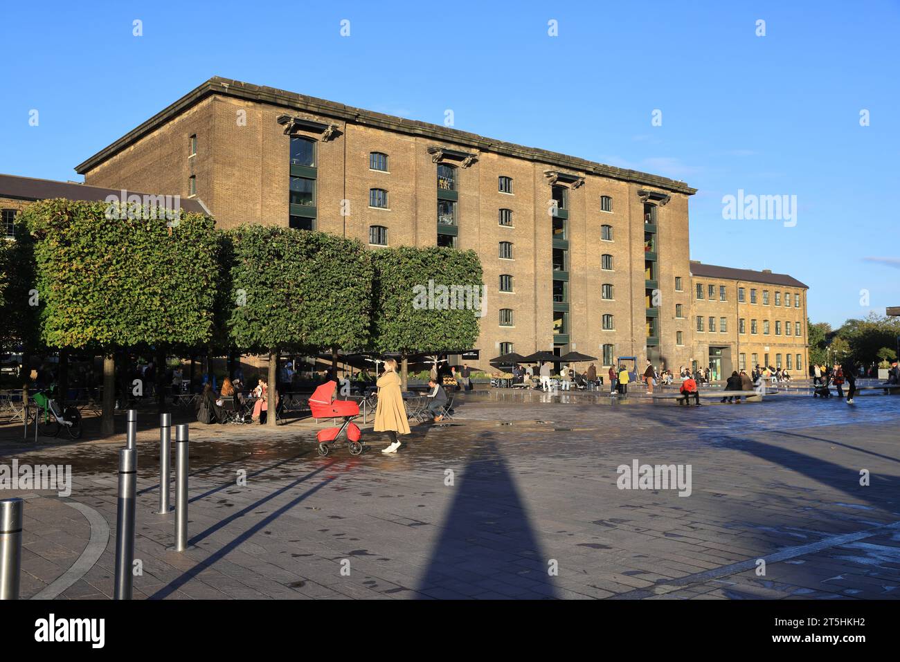 St Martin's Central School of Art on Granary Square in autumn sunshine, at Kings Cross, north London, UK Stock Photo