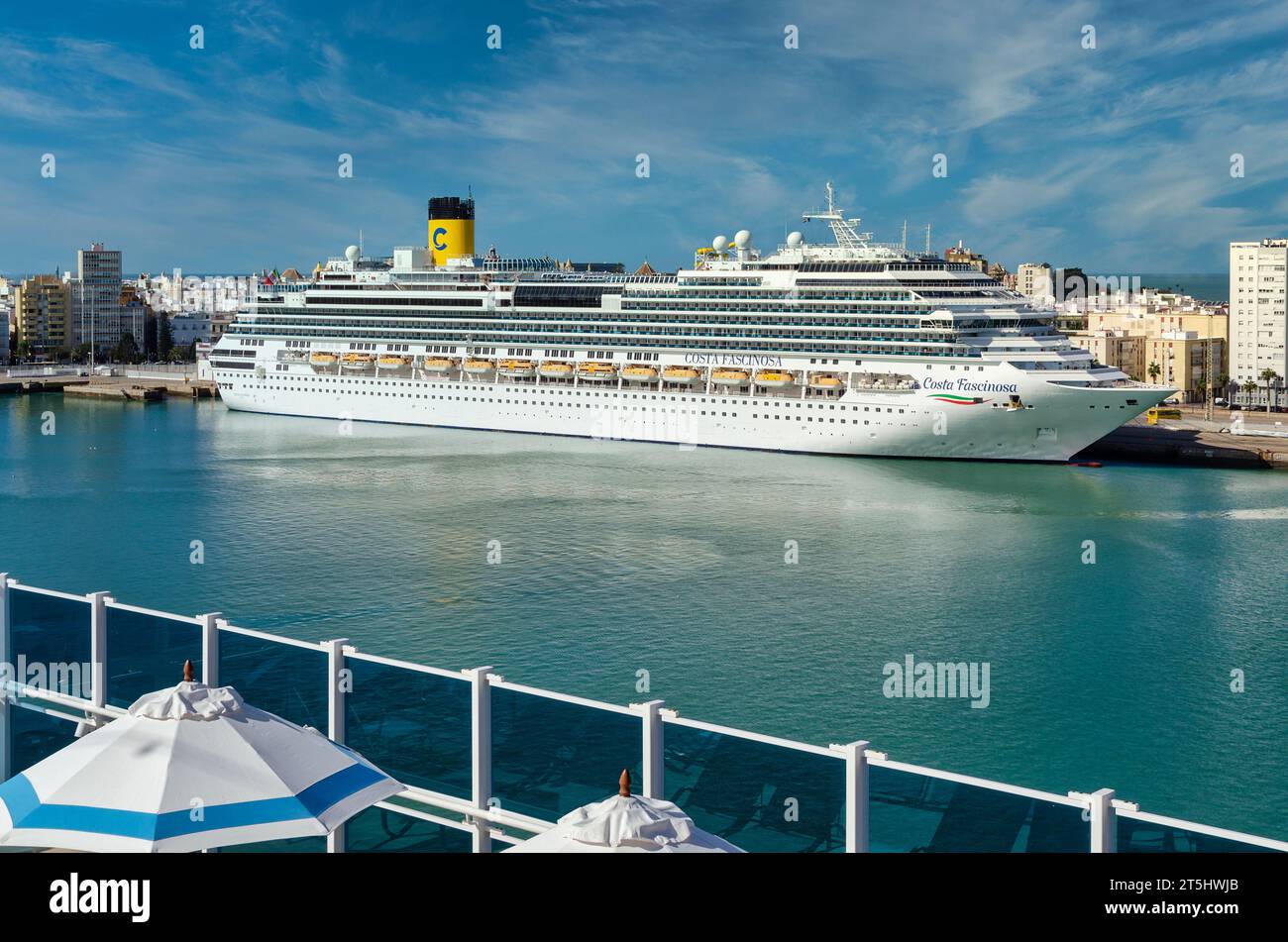 Cadiz, Spain; November 5, 2023: the Costa Fascinosa cruise ship in the harbor of Cadiz on a sunny day.  View from the Costa Firenze ship. Stock Photo