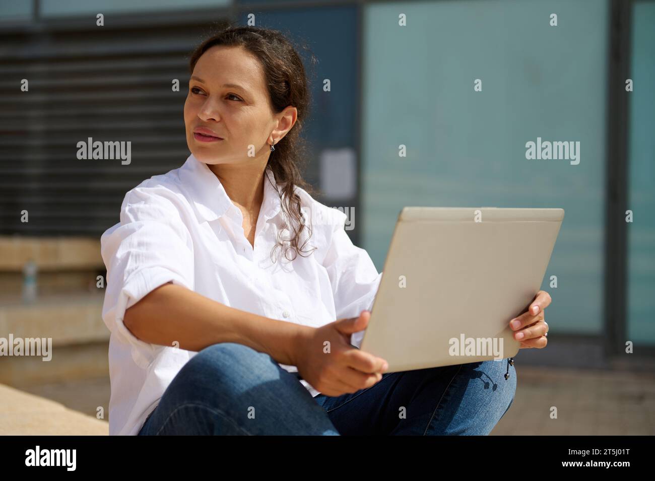 Portrait of a happy young Latin American woman freelancer entrepreneur ...