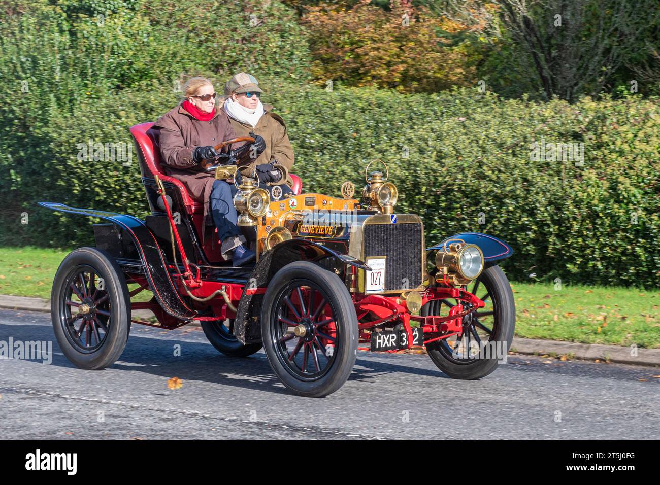 5th November 2023. Participants in the London to Brighton Veteran Car Run 2023 driving through West Sussex, England, UK. The route of the popular annual event runs for 60 miles. A famous 1904 Darracq 10/12 type O car called Genevieve, which featured in the film of the same name 70 years ago. Stock Photo