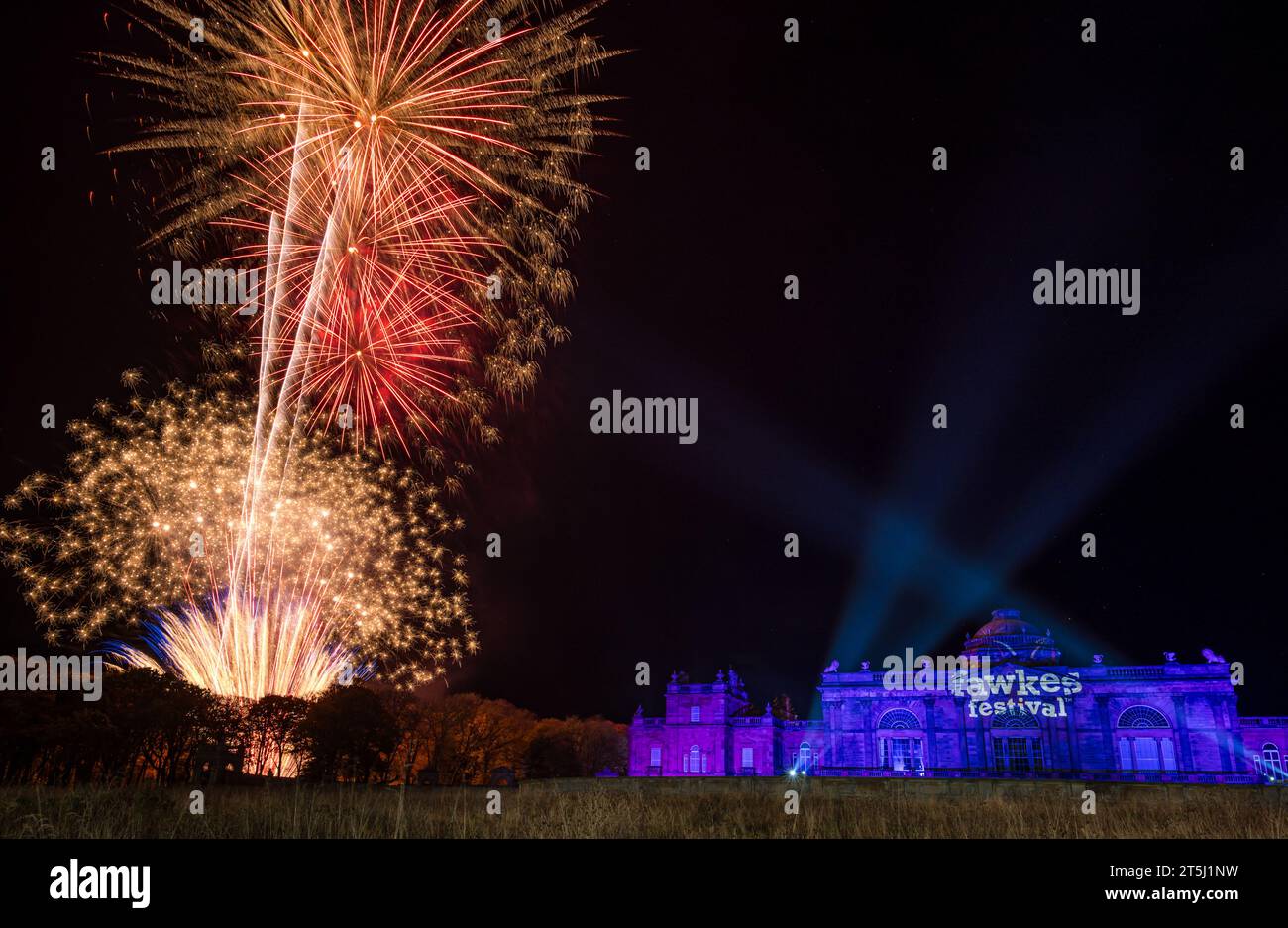 Gosford House, East Lothian, Scotland, UK, 5th November 2023. Fawkes Festival: the fireworks event takes place in the Gosford Estate to celebrate Guy Fawkes night. A large scale fireworks display bursts in the nght sky by the stately country mansion. Credit: Sally Anderson/Alamy Live News Stock Photo