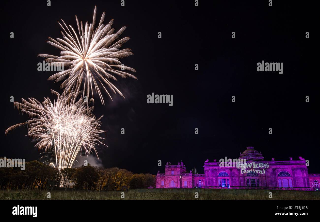 Gosford House, East Lothian, Scotland, UK, 5th November 2023. Fawkes Festival: the fireworks event takes place in the Gosford Estate to celebrate Guy Fawkes night. A large scale fireworks display bursts in the nght sky by the stately country mansion. Credit: Sally Anderson/Alamy Live News Stock Photo